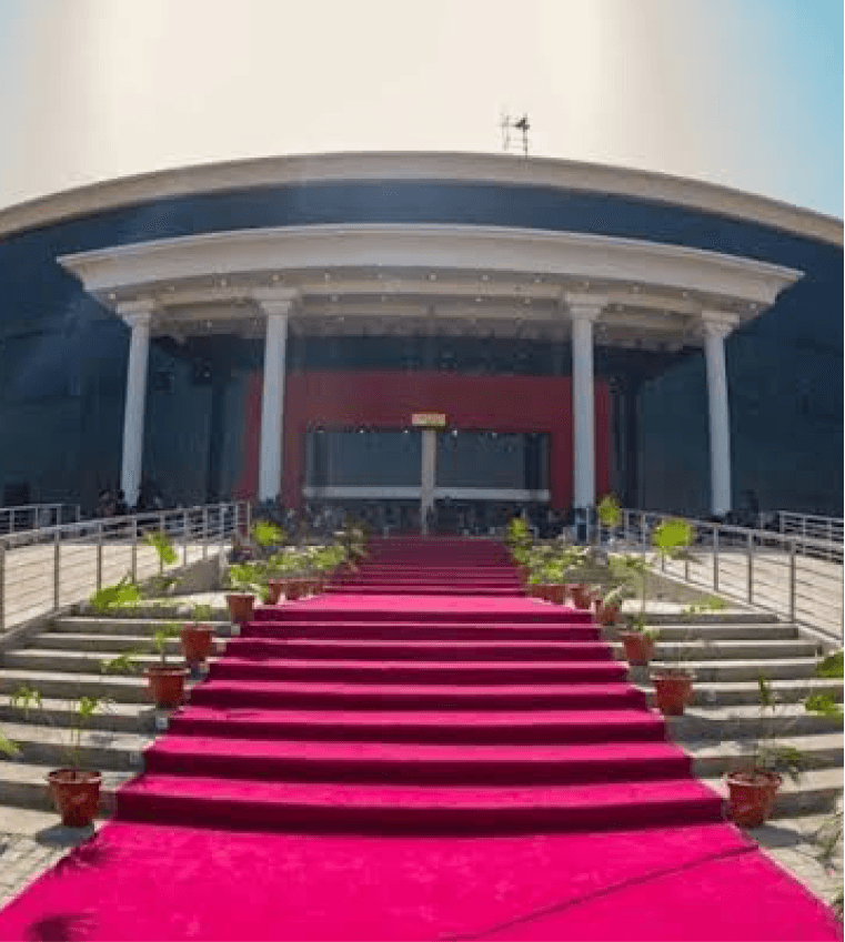 Building entrance with red carpet and staircase